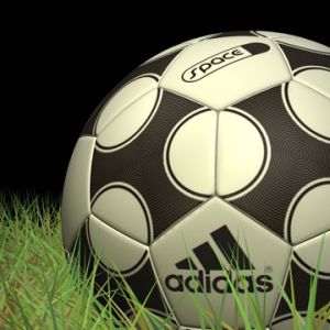 Fotbalový míč Adidas na trávě