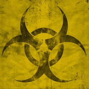Symbol biohazard na žlutém pozadí
