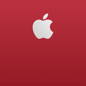 Logo Apple na červeném pozadí
